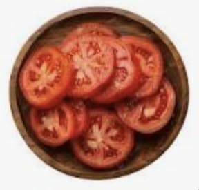Plate of sliced fresh tomatoes at Sakura Asian Dining & Bar