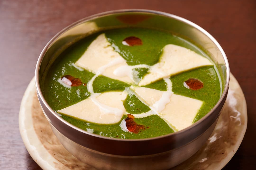 Spinach curry with paneer cubes and cream at Sakura Asian Dining & Bar