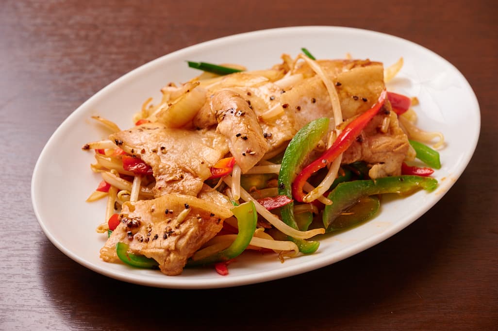 Stir-fried flat noodles with chicken and vegetables at Sakura Asian Dining & Bar